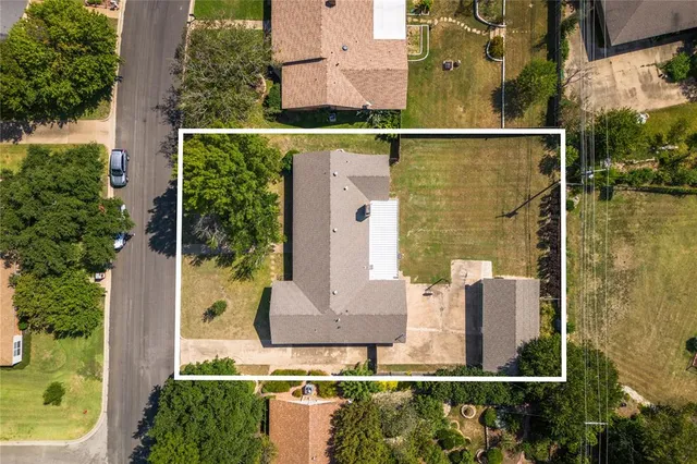 aerial view of a house with a garden