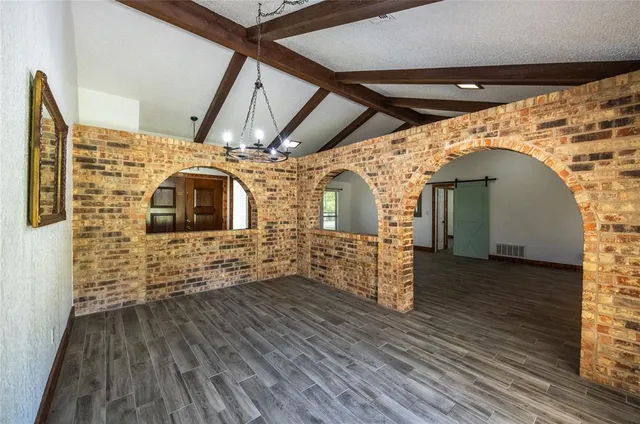 a view of a balcony with wooden floor