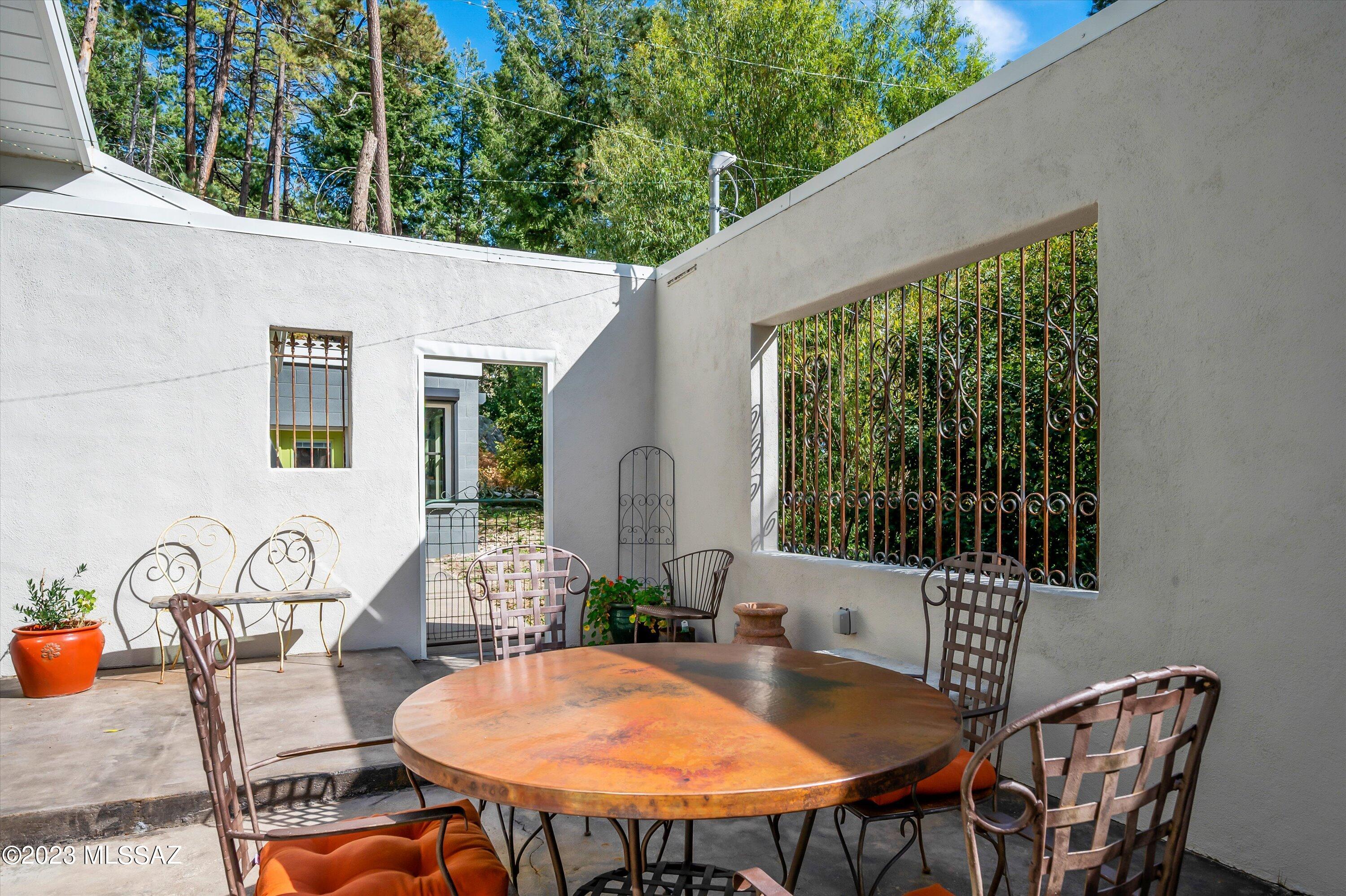 11021 East Turkey Run Road Mount Lemmon, AZ 85619 - Photo 17 of 50 a backyard of a house with table and chairs