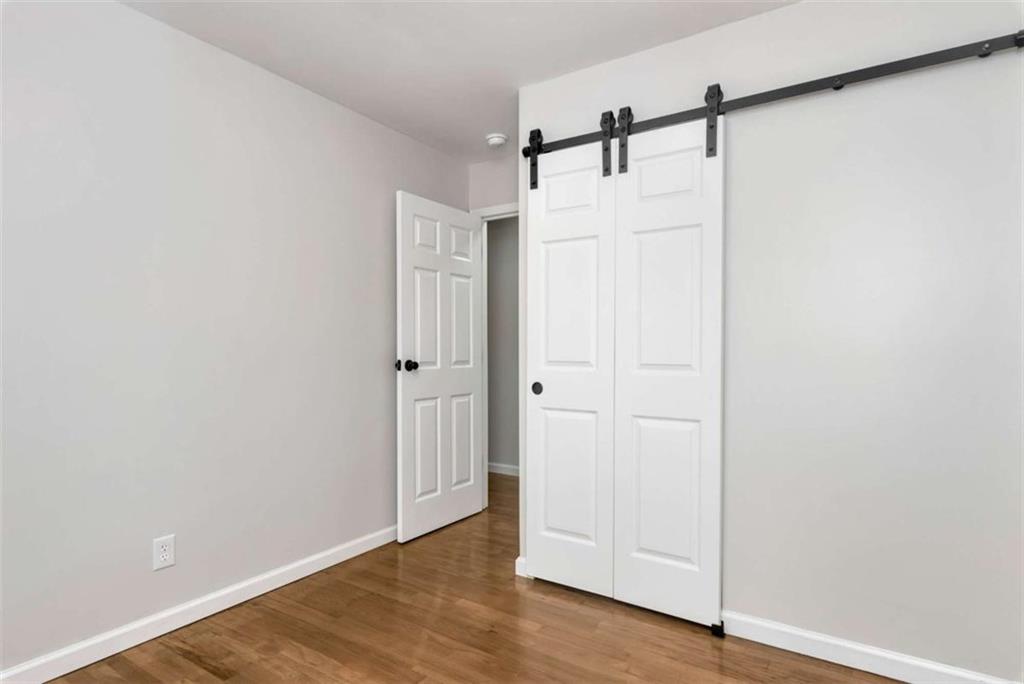145 Beaverdam Road Winterville, GA 30683 - Photo 16 of 39 a view of a hallway with wooden floor