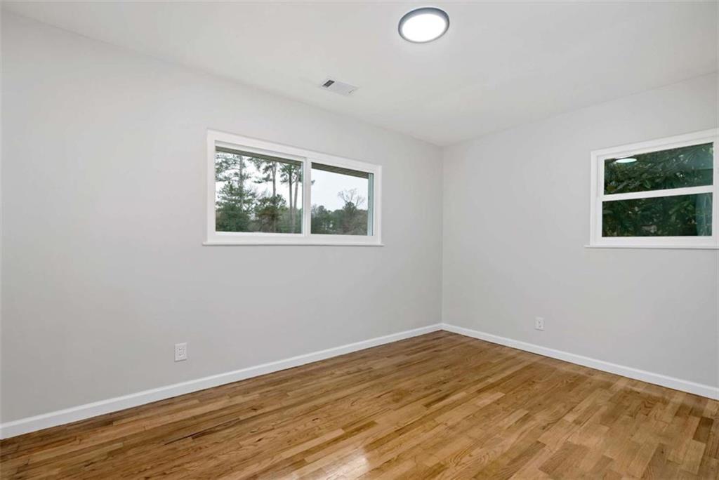 145 Beaverdam Road Winterville, GA 30683 - Photo 17 of 39 a view of empty room with wooden floor and fan