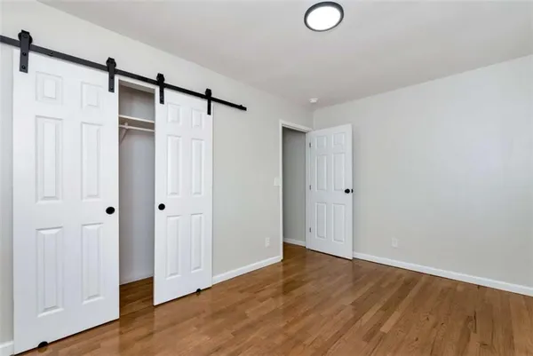 a view of bathroom with wooden floor
