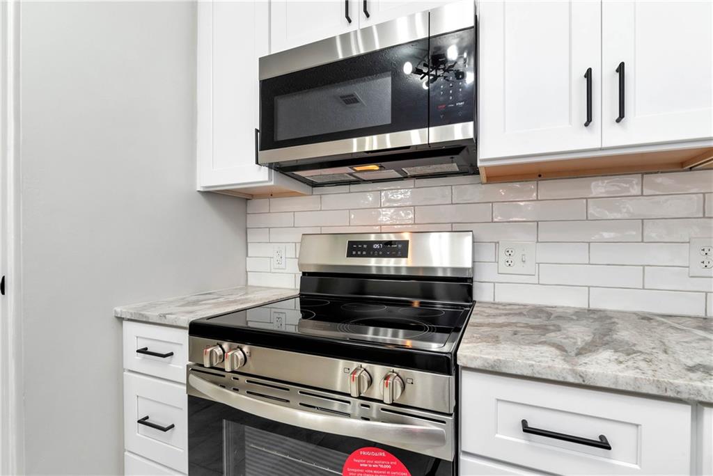 145 Beaverdam Road Winterville, GA 30683 - Photo 19 of 53 a stove top oven sitting inside of a kitchen
