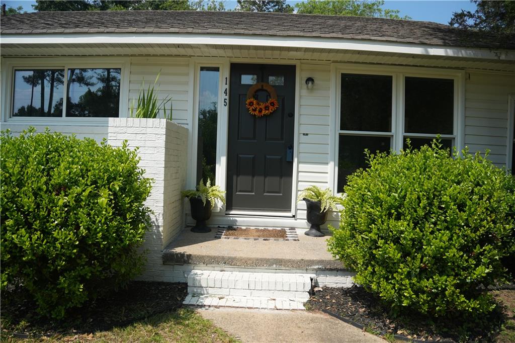 145 Beaverdam Road Winterville, GA 30683 - Photo 2 of 53 a front view of a house with garden