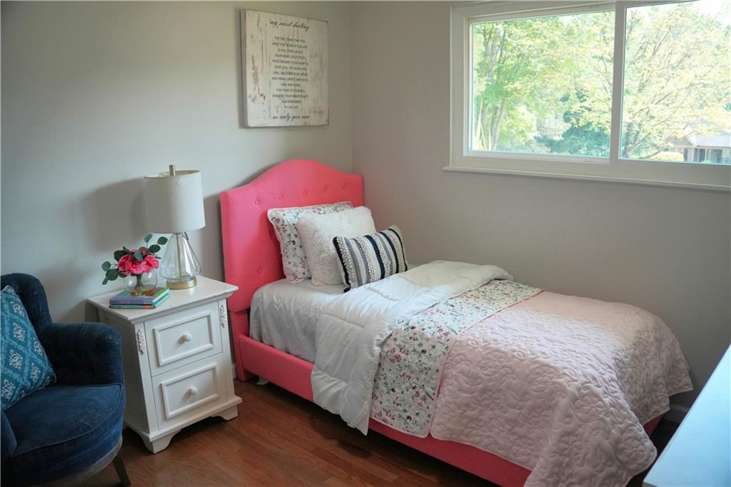 145 Beaverdam Road Winterville, GA 30683 - Photo 23 of 53 a bedroom with a bed and window