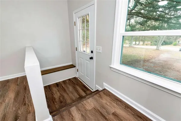 a view of an empty room and window