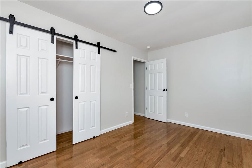 145 Beaverdam Road Winterville, GA 30683 - Photo 27 of 53 a view of walk in closet with wooden floor