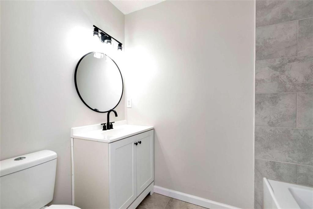 145 Beaverdam Road Winterville, GA 30683 - Photo 27 of 39 a bathroom with a toilet a sink and a mirror