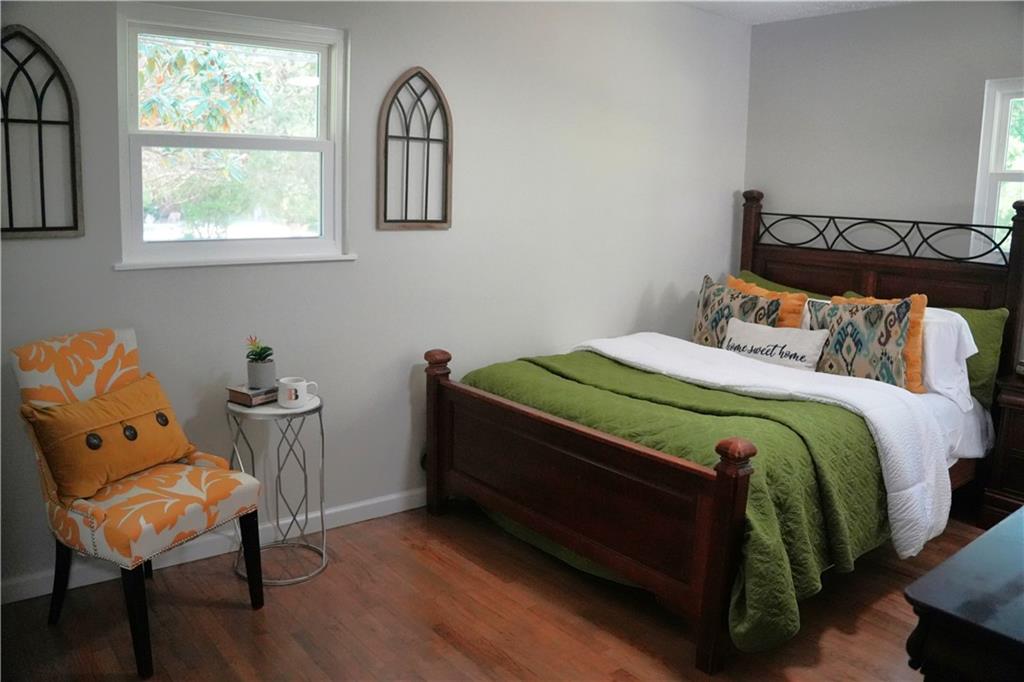 145 Beaverdam Road Winterville, GA 30683 - Photo 29 of 53 a bedroom with a bed chair and window