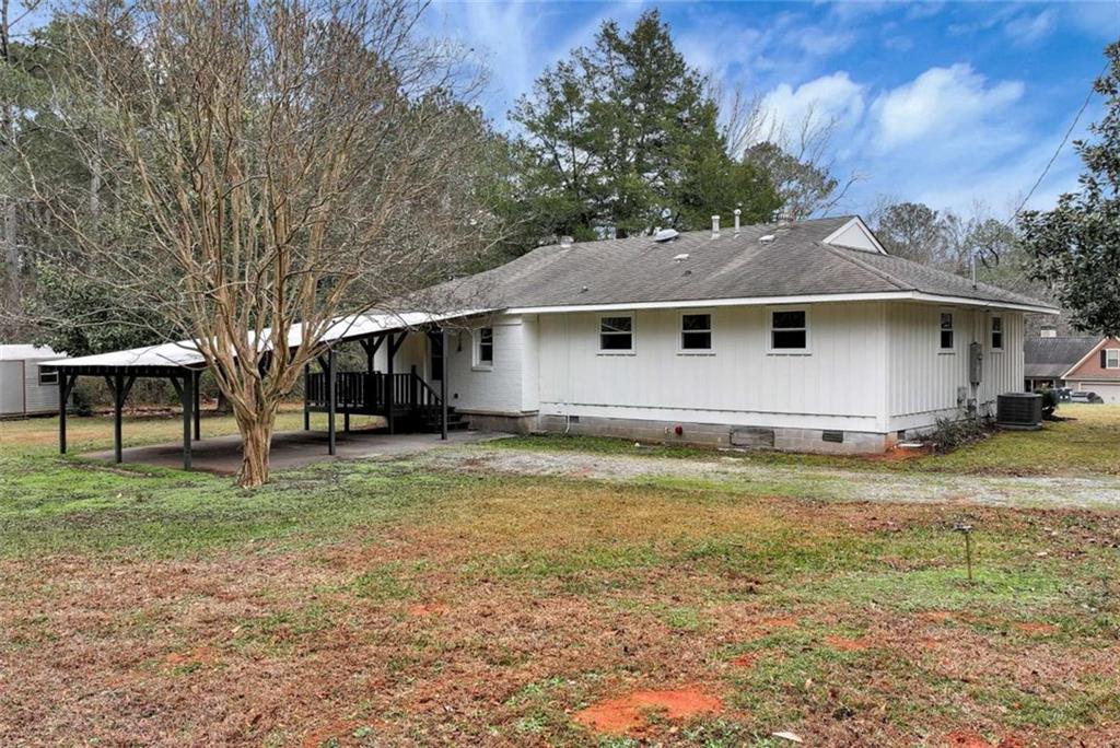 145 Beaverdam Road Winterville, GA 30683 - Photo 31 of 39 a backyard of a house with table and chairs