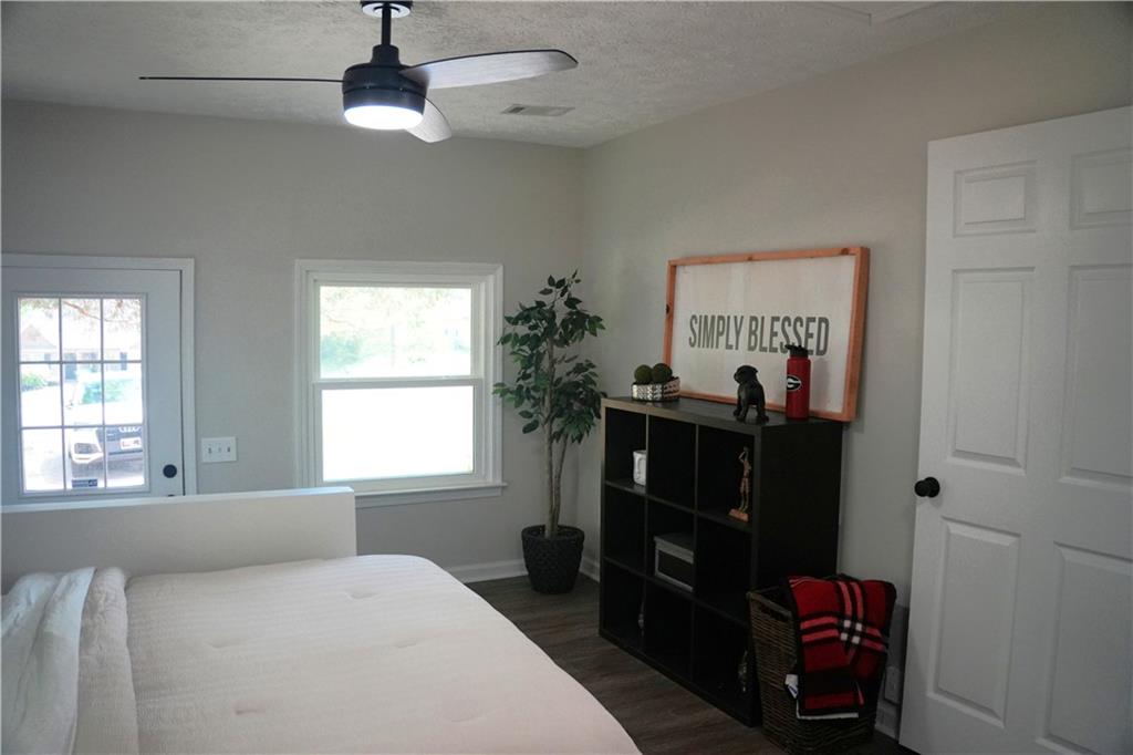 145 Beaverdam Road Winterville, GA 30683 - Photo 38 of 53 a bedroom with a bed and a window