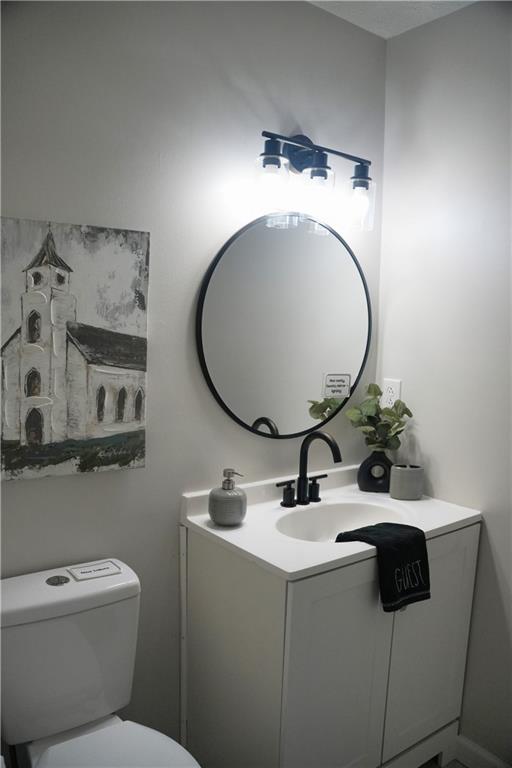 145 Beaverdam Road Winterville, GA 30683 - Photo 41 of 53 a bathroom with a toilet sink and mirror