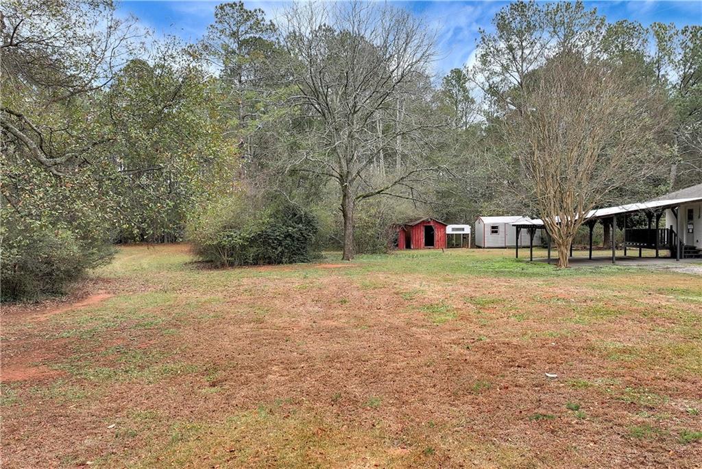 145 Beaverdam Road Winterville, GA 30683 - Photo 47 of 53 a view of a house with a yard