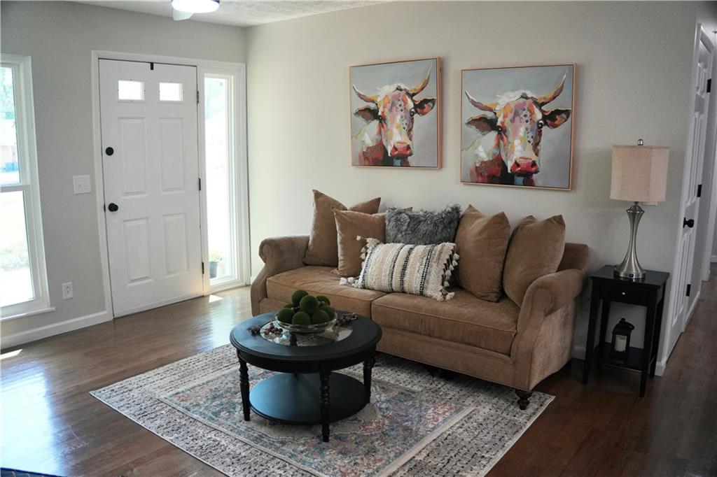 145 Beaverdam Road Winterville, GA 30683 - Photo 7 of 53 a living room with furniture and a window