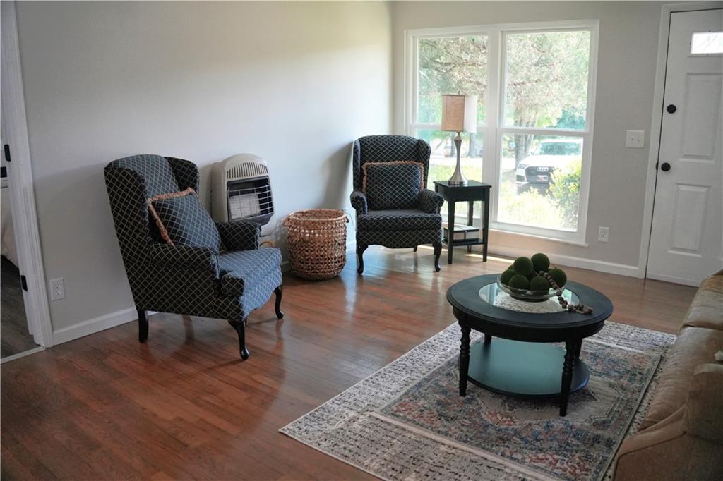 145 Beaverdam Road Winterville, GA 30683 - Photo 8 of 53 a living room with furniture and a potted plant