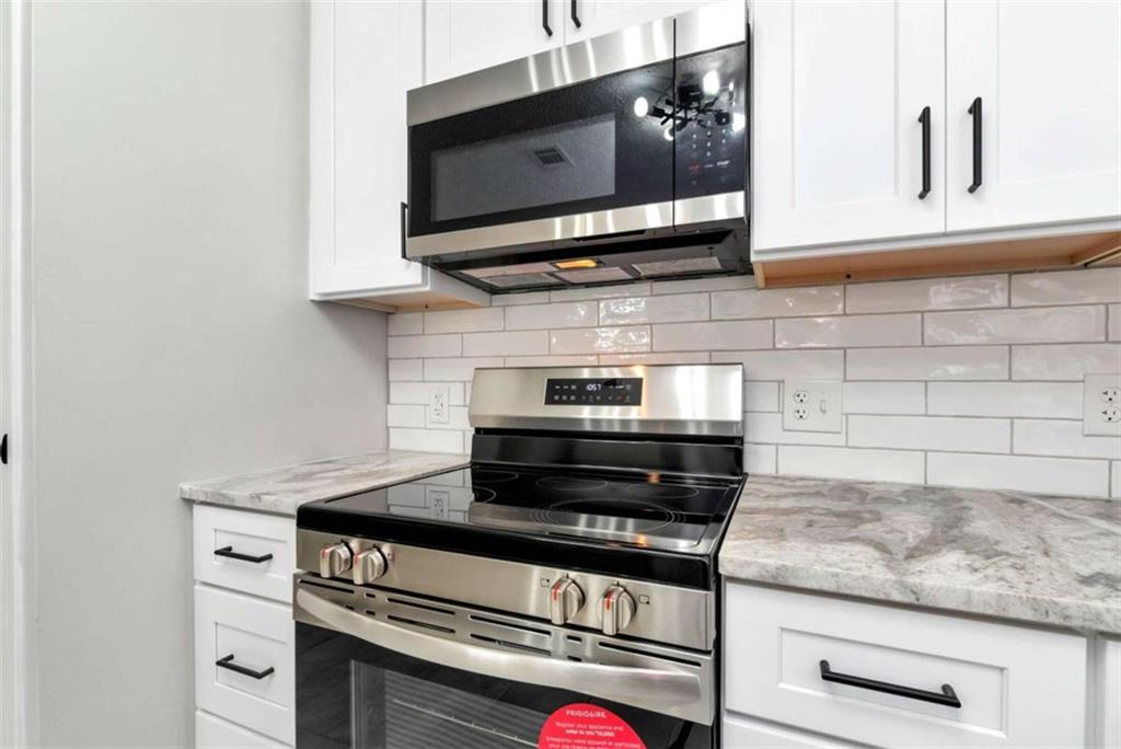 145 Beaverdam Road Winterville, GA 30683 - Photo 9 of 39 a stove top oven sitting inside of a kitchen