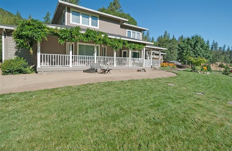 4866 Upper Applegate Road Jacksonville, OR 97530 - Photo 6 of 31 The wiseria covers the front porch area