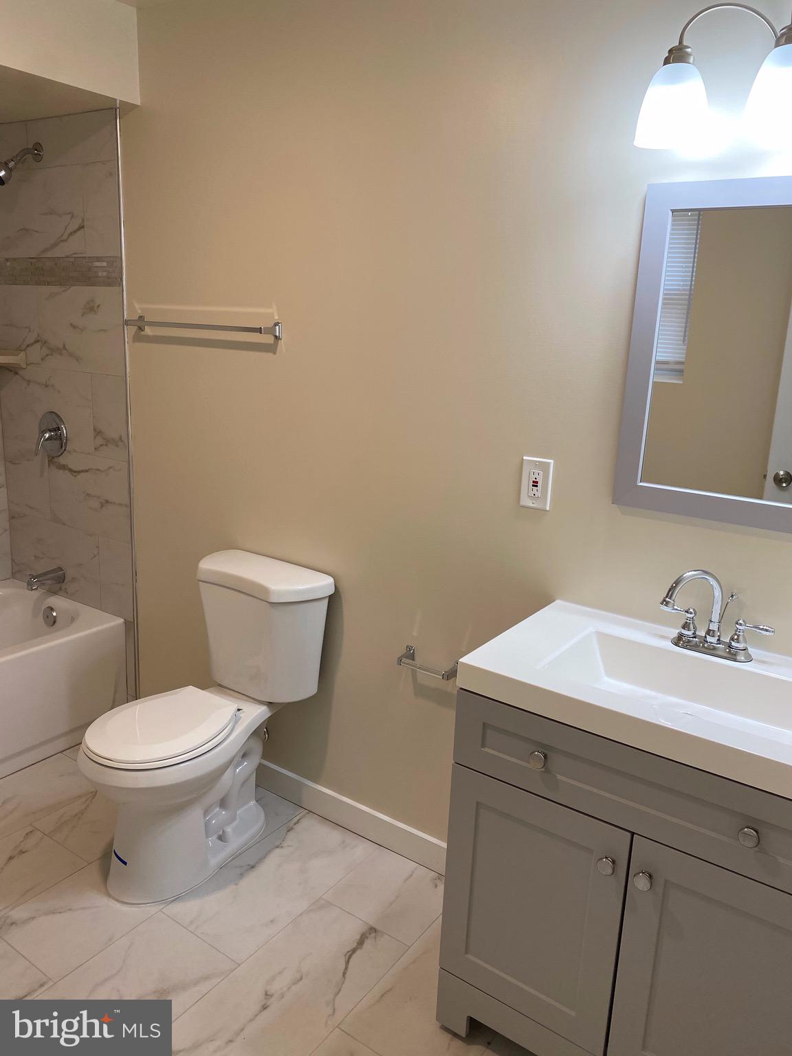 15702 Livingston Road Accokeek, MD 20607 - Photo 14 of 25 Bathroom view with new ceramic tile flooring
