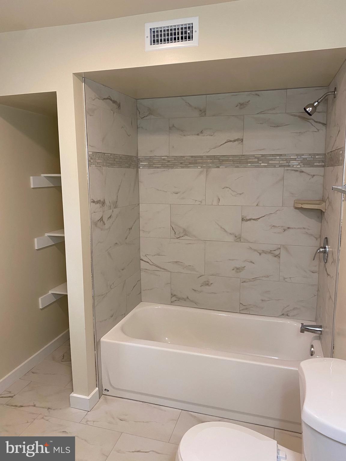 15702 Livingston Road Accokeek, MD 20607 - Photo 15 of 25 New wall tile view of bathroom
