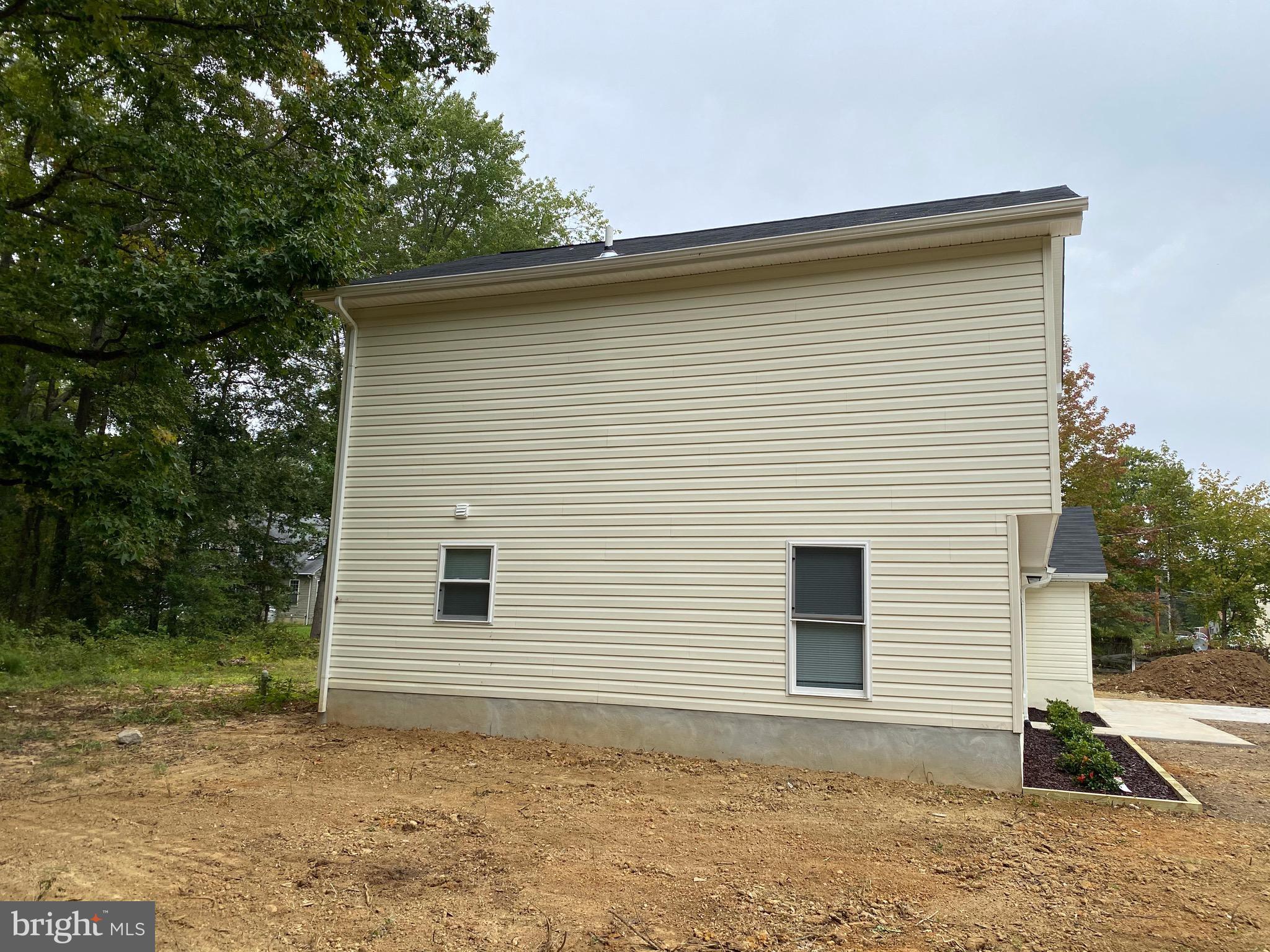 15702 Livingston Road Accokeek, MD 20607 - Photo 24 of 25 Side View of Home (regrading & seed to be done)
