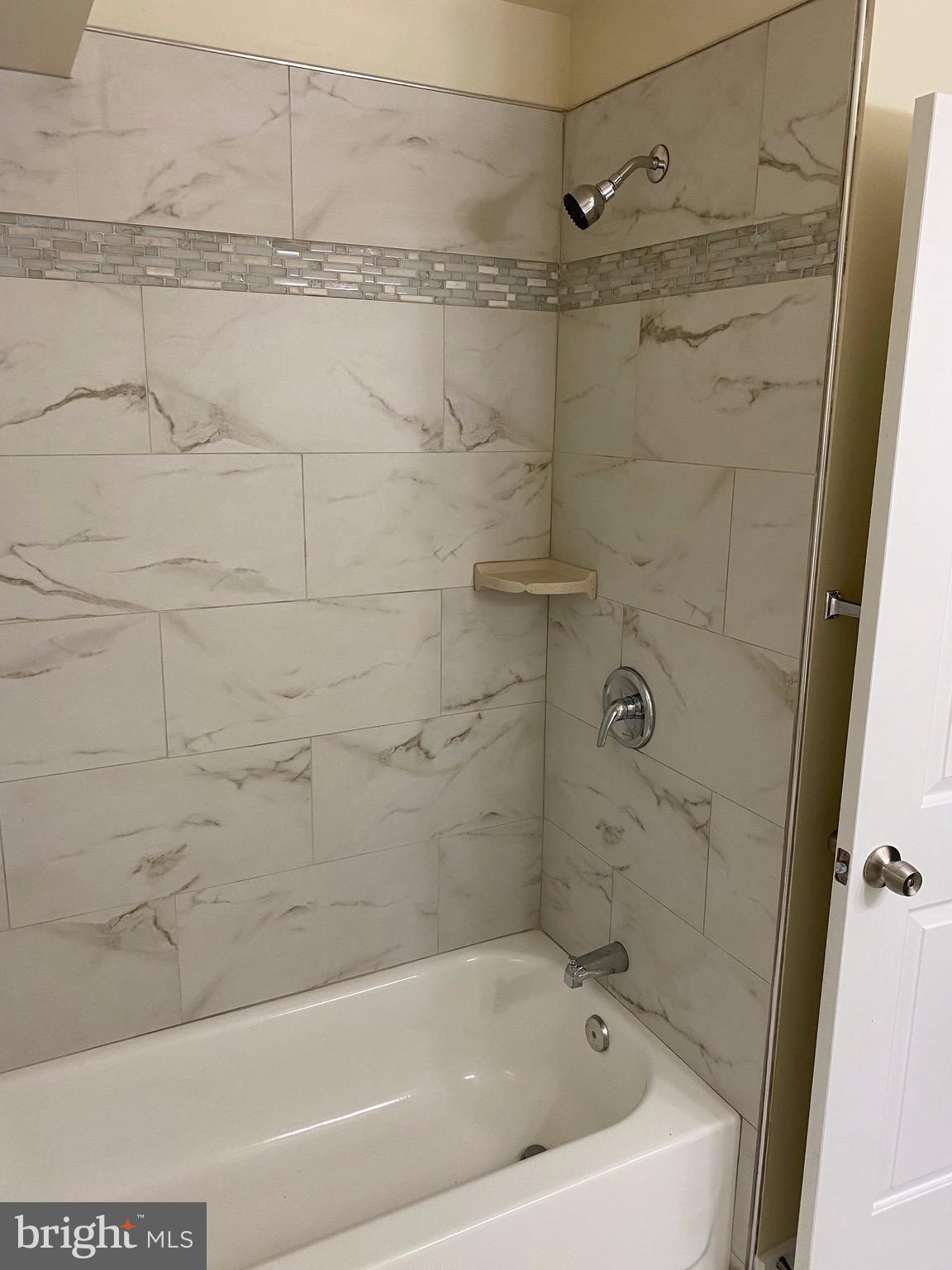 15702 Livingston Road Accokeek, MD 20607 - Photo 9 of 25 Bathroom shower with new ceramic wall tile