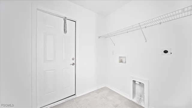 a bathroom with a shower and a glass door