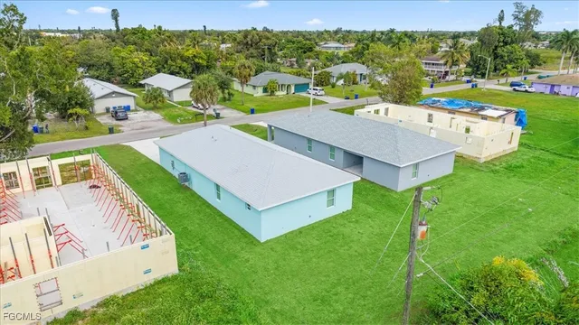 an aerial view of a house with swimming pool garden and mountain view