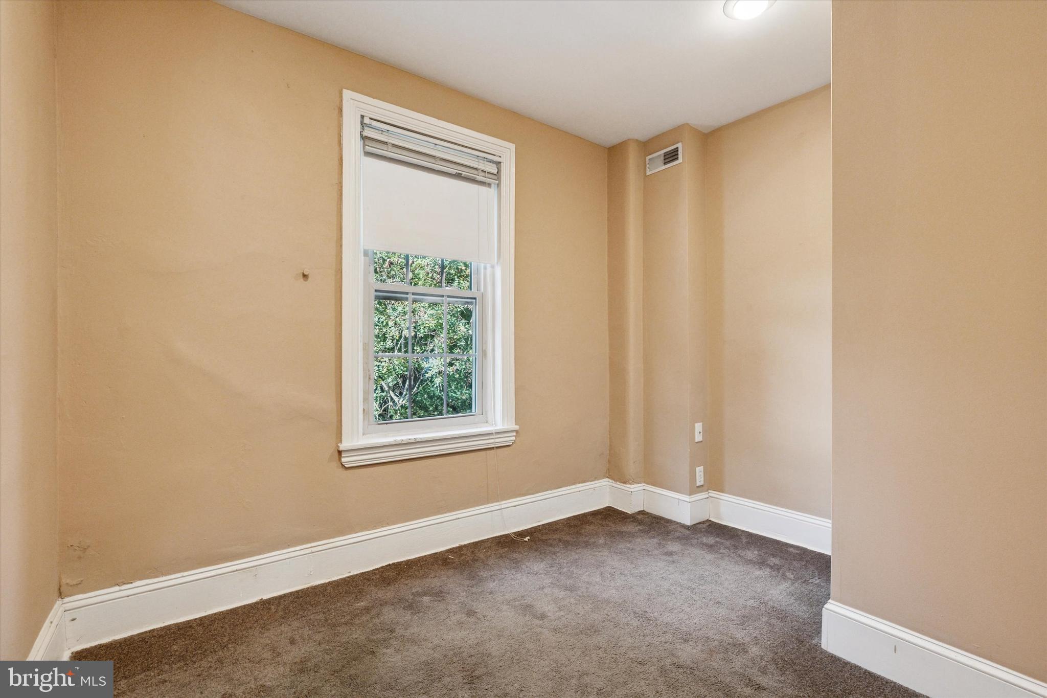4148 Manayunk Avenue Philadelphia, PA 19128 - Photo 12 of 15 an empty room with a window