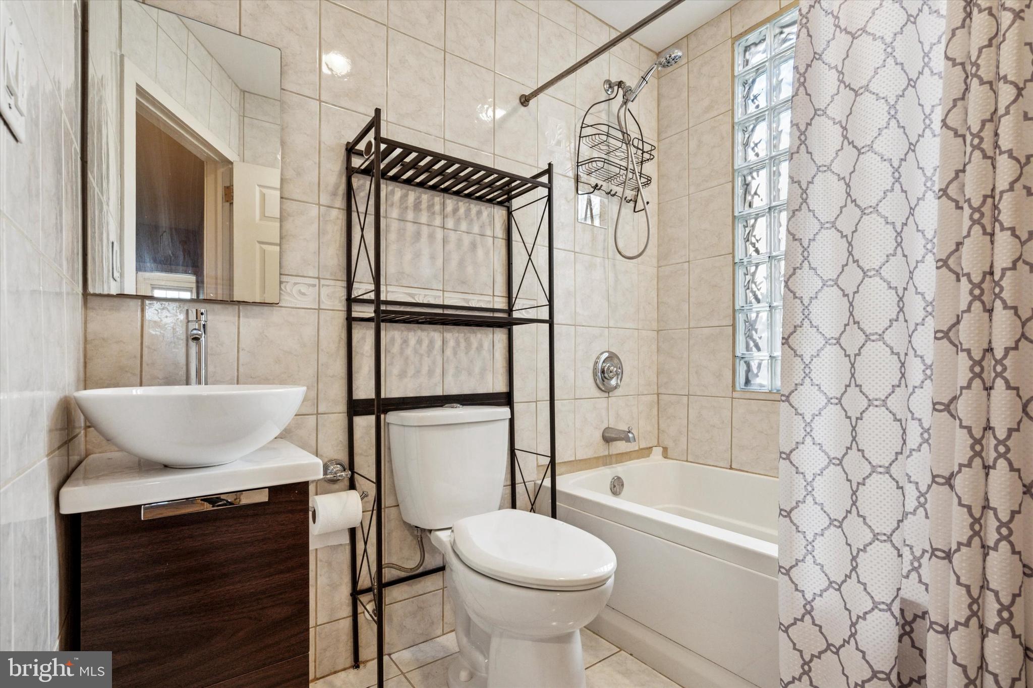 4148 Manayunk Avenue Philadelphia, PA 19128 - Photo 13 of 15 a bathroom with a sink toilet and shower