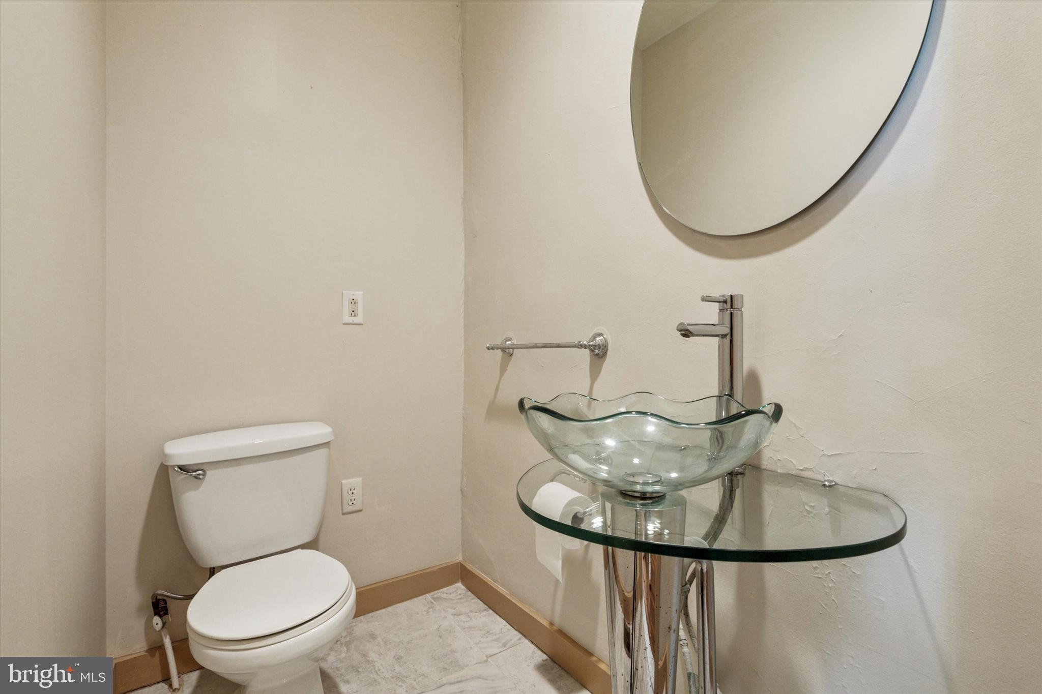 4148 Manayunk Avenue Philadelphia, PA 19128 - Photo 8 of 15 a bathroom with a toilet and a mirror