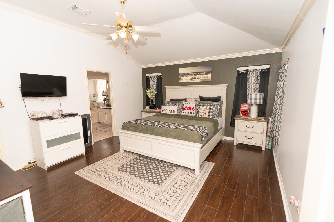 17426 Colony Creek Drive Spring, TX 77379 - Photo 13 of 26 a bedroom with a bed and a flat screen tv