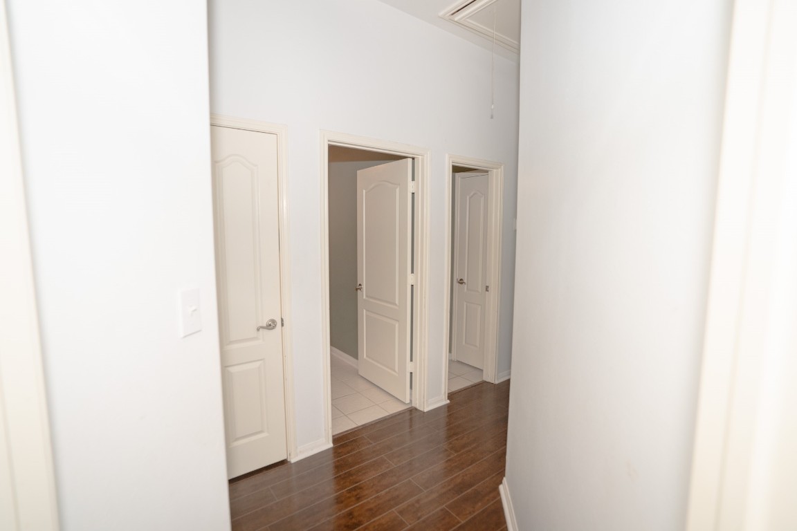 17426 Colony Creek Drive Spring, TX 77379 - Photo 18 of 26 a view of a hallway with wooden floor