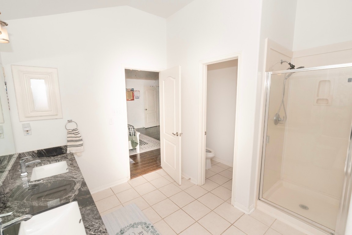 17426 Colony Creek Drive Spring, TX 77379 - Photo 19 of 26 a bathroom with a sink and a mirror