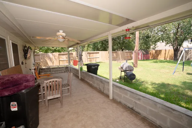a view of a porch and garden