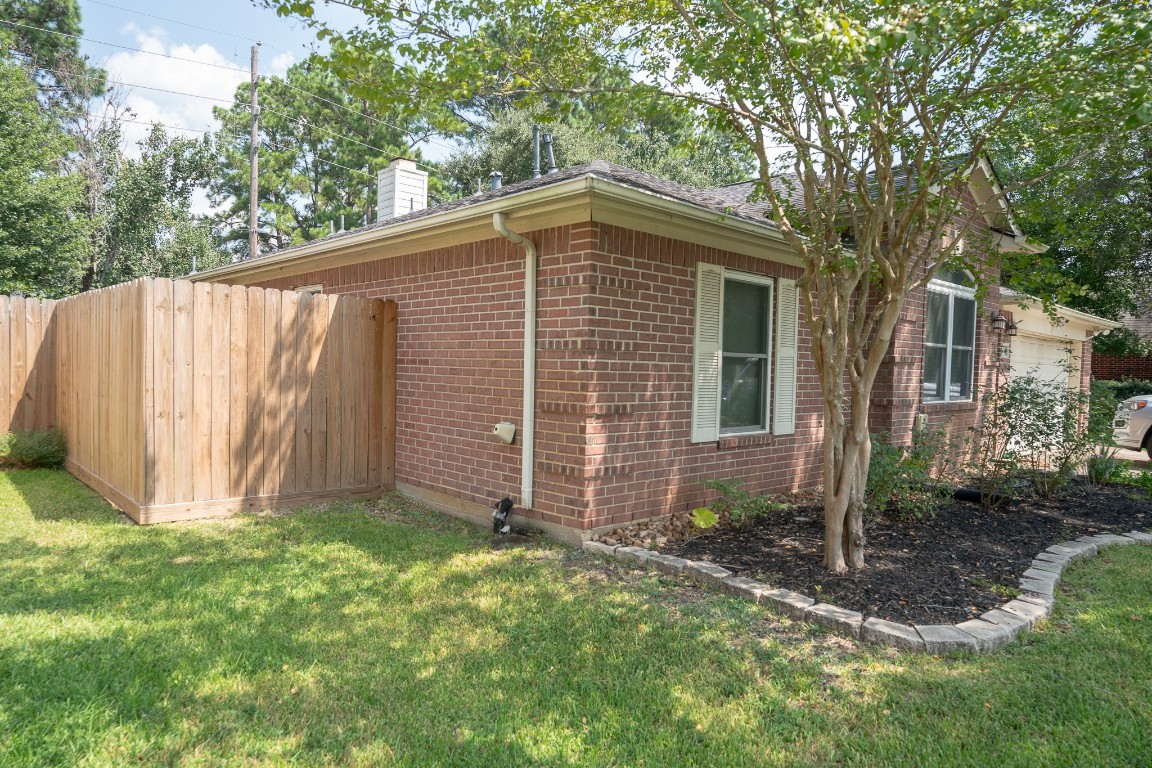 17426 Colony Creek Drive Spring, TX 77379 - Photo 24 of 26 a view of a backyard with a small cabin
