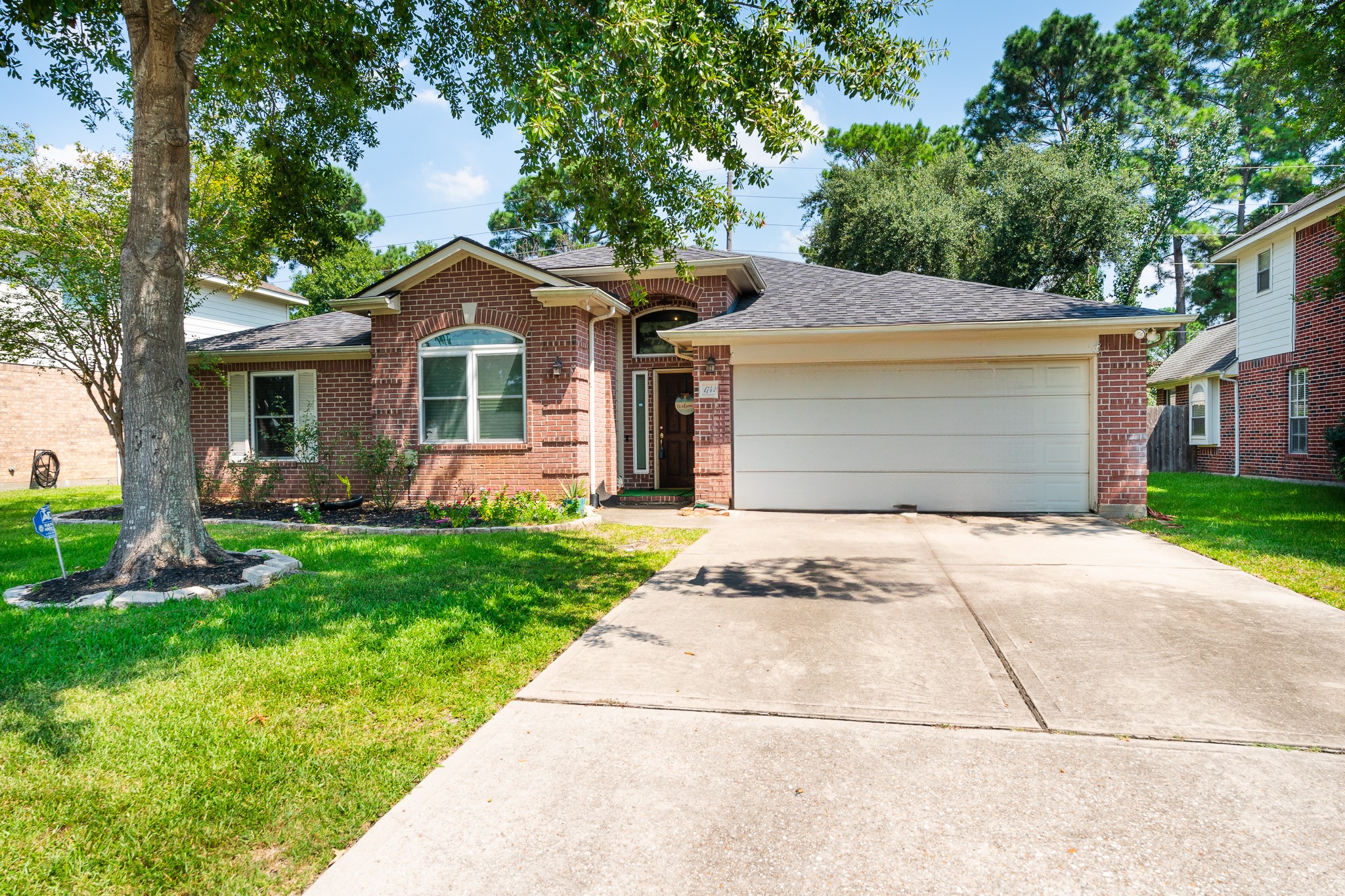 17426 Colony Creek Drive Spring, TX 77379 - Photo 3 of 26 a front view of house with yard and green space