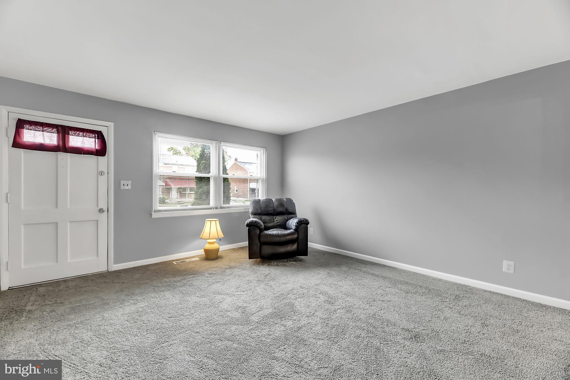 774 Lannerton Road Baltimore, MD 21220 - Photo 3 of 24 Living room with new carpet and fresh paint