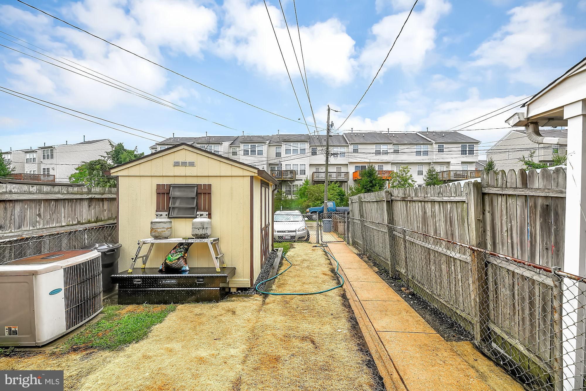 774 Lannerton Road Baltimore, MD 21220 - Photo 22 of 24 Rear exterior with storage shed and privacy fence