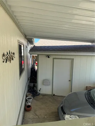 a balcony with hardwood filled with table and chairs