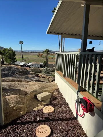 a living room with lots of furniture and a wooden floor