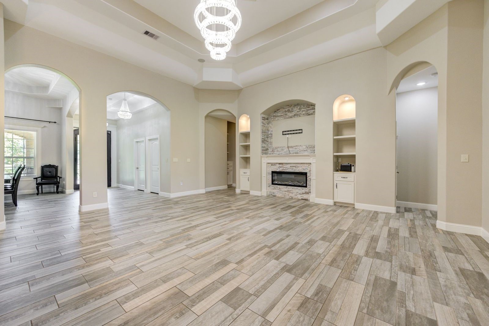 21038 Angus Drive Cleveland, TX 77328 - Photo 18 of 49 a view of a livingroom with a furniture hardwood floor and a ceiling fan