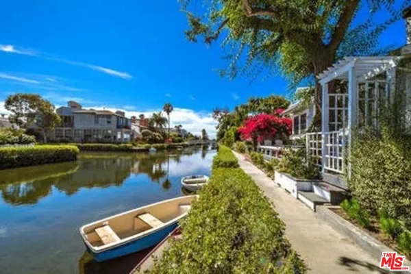 a view of a lake with a house in the background