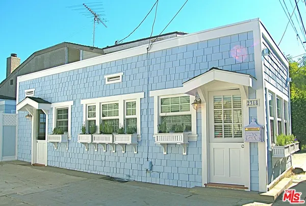 a front view of a house with a glass door