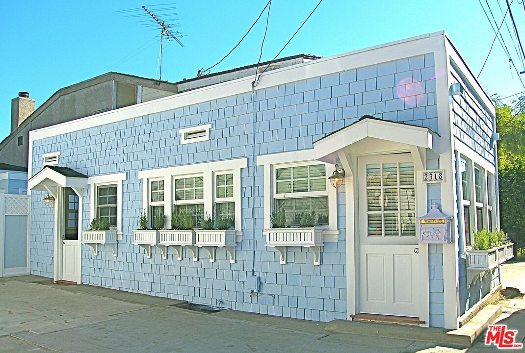 2318 Strongs Drive Venice, CA 90291 - Photo 2 of 19 a front view of a house with a glass door