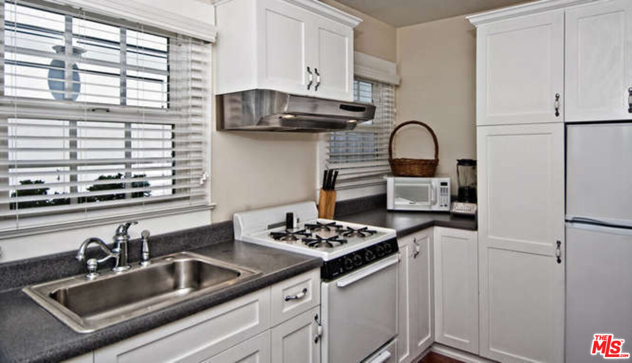 2318 Strongs Drive Venice, CA 90291 - Photo 6 of 19 a kitchen with sink a stove and cabinets