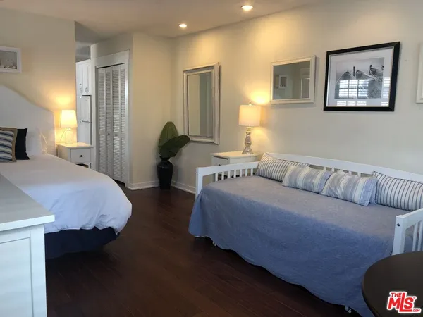 a bedroom with bed and window