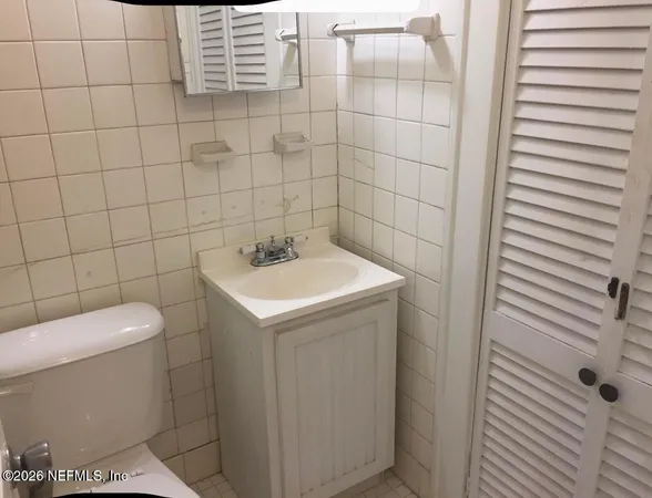 a utility room with a sink dryer and washer