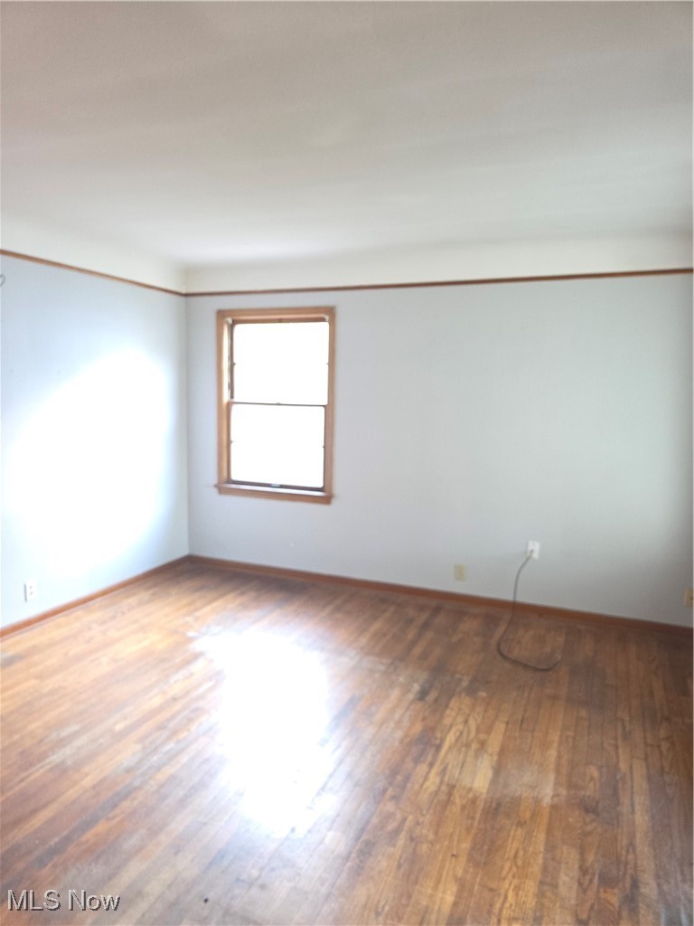 14712 Rockside Road Maple Heights, OH 44137 - Photo 8 of 23 Living room with baseboards and wood finished floors