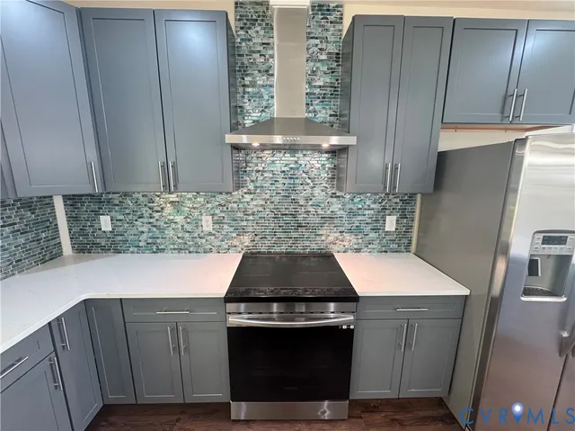 a bathroom with a sink a toilet a mirror and shower