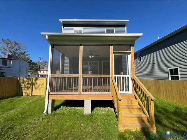 a living room with a fireplace and a floor to ceiling window